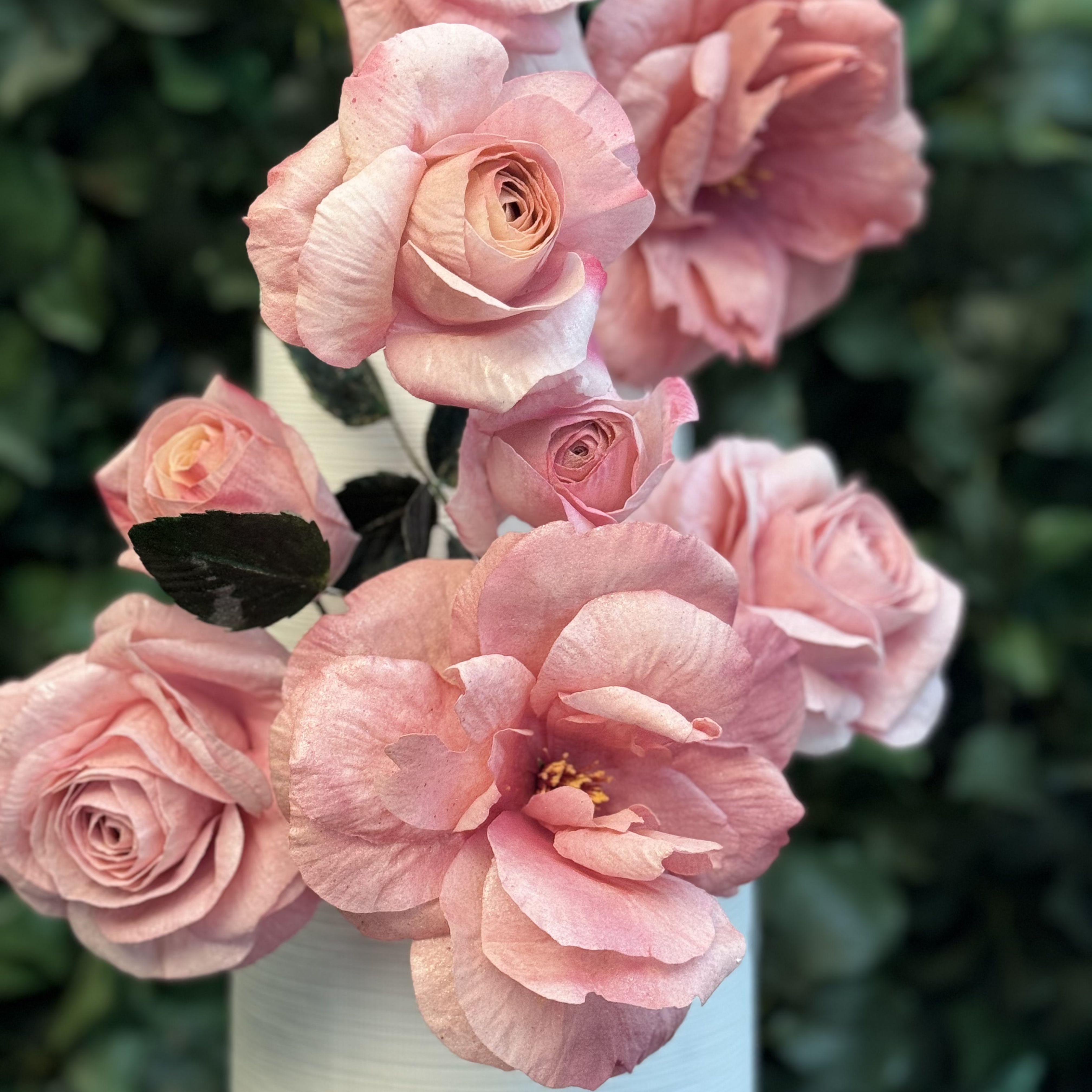 Bouquet of pink roses with a blurred green background